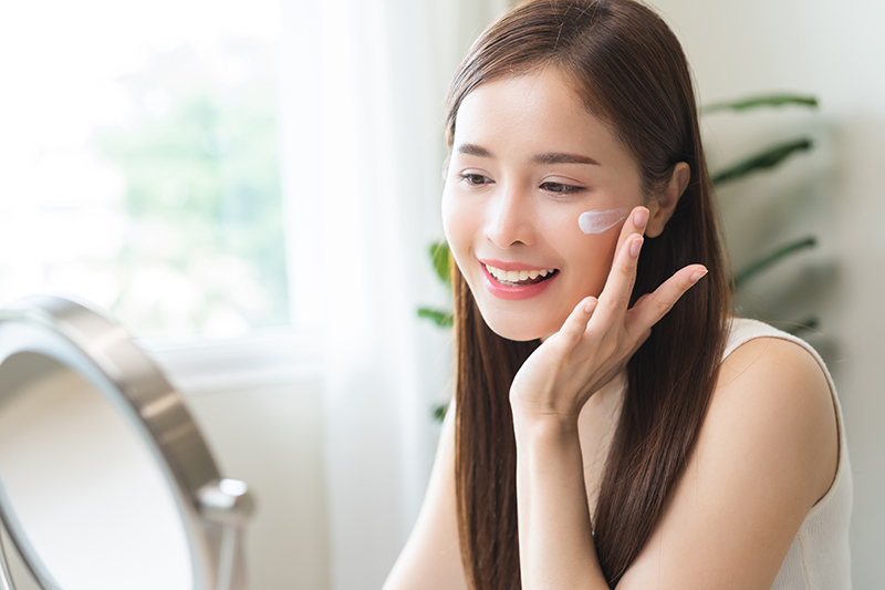 A woman after receiving dermatology treatment